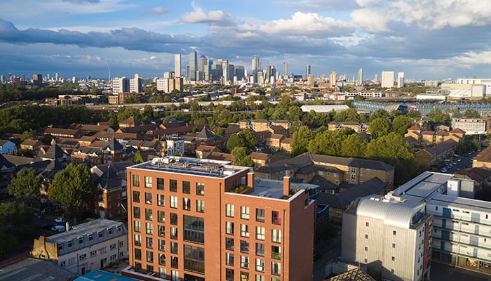 Bird's-eye view of Pocket Living's development in Southwark with the London skyline behind it.